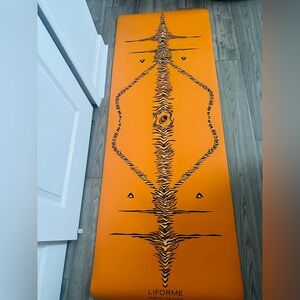 Orange and Black Liforme yoga mat